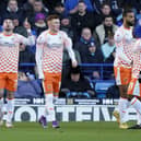 Owen Dale celebrates his goal for Blackpool at Pompey today.