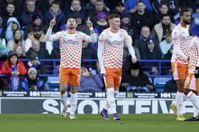 Owen Dale celebrates his goal for Blackpool at Pompey today.