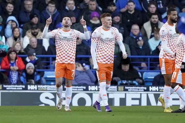 Owen Dale celebrates his goal for Blackpool at Pompey today.