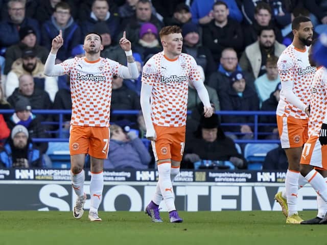 Owen Dale celebrates his goal for Blackpool at Pompey today.