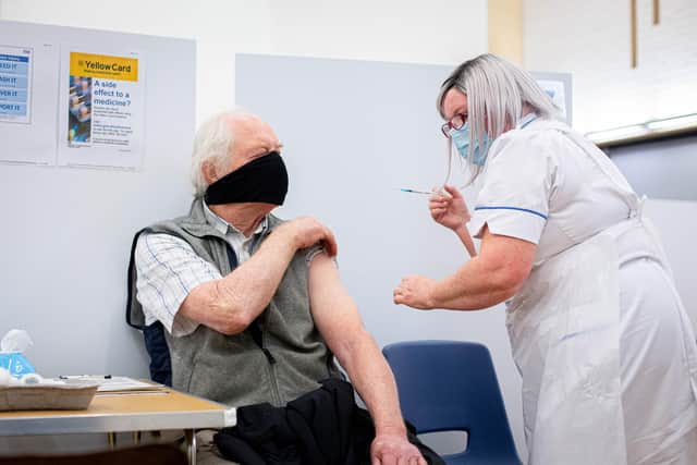 Keith Smart getting his vaccine from Nurse Helen Brunton
Picture: Habibur Rahman