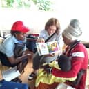 Carol Dyer in Uganda distributing Wheelchairs