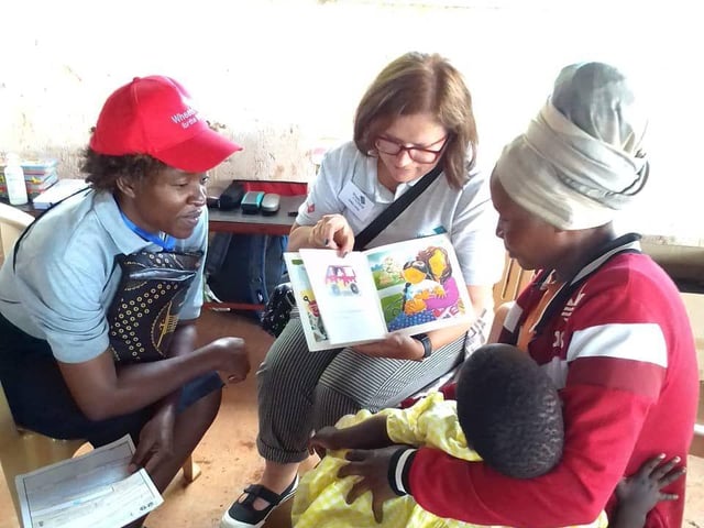 Carol Dyer in Uganda distributing Wheelchairs