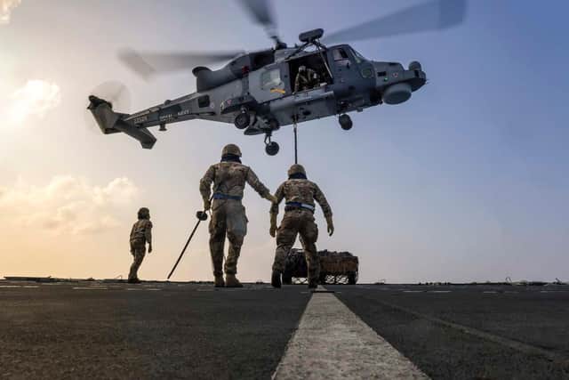 A Merlin helicopter shows how it can deliver vital aid during disaster relief operations while at the British Virgin Islands