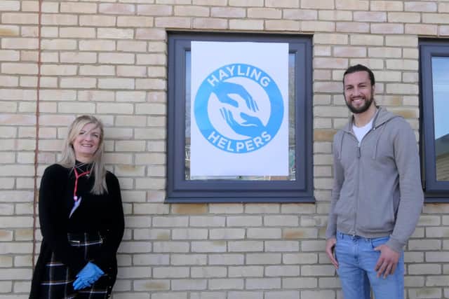 Portsmouth defender Christian Burgess pictured with Wendy Ball of the Hayling Helpers, who along with Heart of Hayling Boxing Academy volunteers have been delivering prescriptions to islanders.