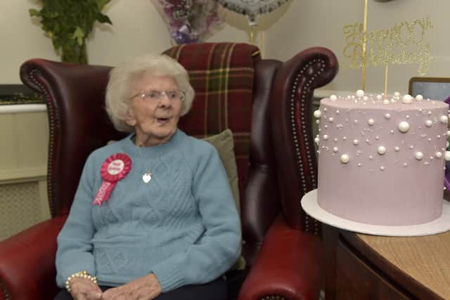 Pearl Hunter eyes up her cake Picture: Sarah Standing (151122-6351)