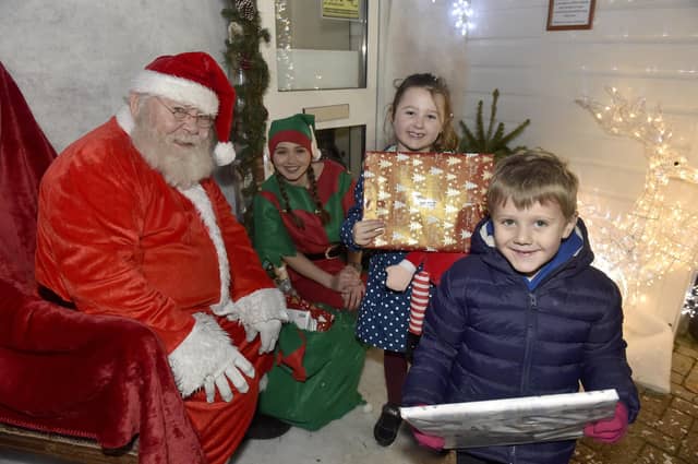 Lee-on-the-Solent Christmas lights were switched on in the High Street on Friday, November 24.
Pictured is: Cousins Penny Ware (5) from Gosport and Henry Ware (4) from Fareham, meeting Father Christmas.
Picture: Sarah Standing (241123-2263)