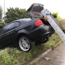 Car crashes through barrier. Pic HIWFRS