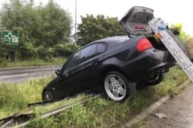 Car crashes through barrier. Pic HIWFRS