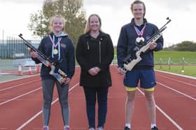 Paige and James Baxter pictured with their mum Bronwyn after winning their Target Sprint medals in Yate. Picture by Paul Smith.
