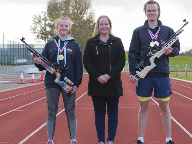 Paige and James Baxter pictured with their mum Bronwyn after winning their Target Sprint medals in Yate. Picture by Paul Smith.