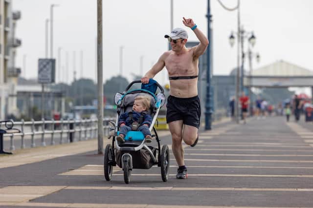 A competitor enjoying pushing a buggy in the Southsea parkrun. Picture: Mike Cooter