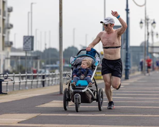 A competitor enjoying pushing a buggy in the Southsea parkrun. Picture: Mike Cooter