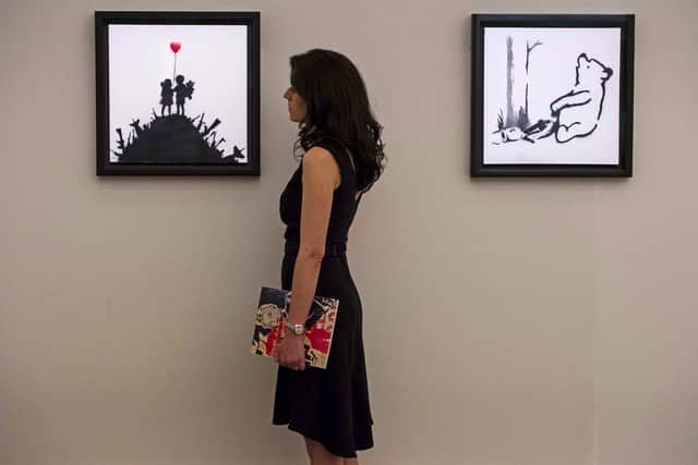 Banksy's "Winnie the Pooh" on display at Bonham's auction house in 2014. Picture: NIKLAS HALLE'N/AFP via Getty Images