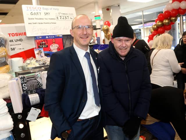 Cosham Tesco store manager Rob Milner with Gary Smy. Picture: Sam Stephenson.