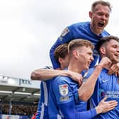 Pompey players celebrate with George Hirst after netting his second in Saturday's 4-0 triumph over Accrington. Picture: Nigel Keene/ProSportsImages