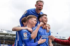 Pompey players celebrate with George Hirst after netting his second in Saturday's 4-0 triumph over Accrington. Picture: Nigel Keene/ProSportsImages