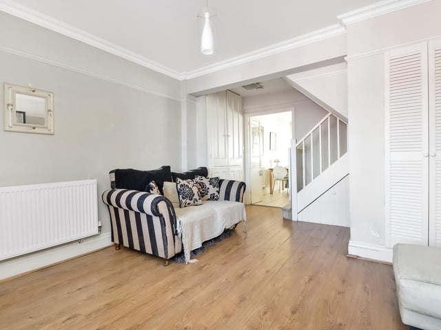 The property features a spacious ground floor living room.