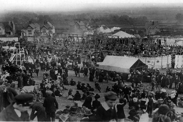 Taken from Cosham. The annual fair held on the downs of Portsdown Hill just above Southwick Hill Road and the house seen are on the old A3 going up the hill from Cosham.Most of the swings are Skye Boat swings. Picture: Costen.co.uk
