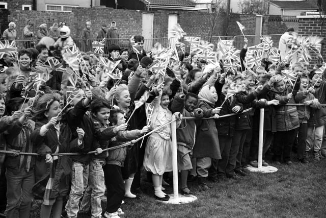 Local school children cheer the arrival of the Duke of Edinburgh at Harrison House, Stamshaw on the 24th March 1988.
Picture: (B3848-1)
