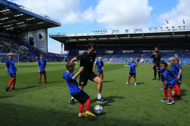 Danny Cowley takes part in a kickaround with the mascots before kick-off.