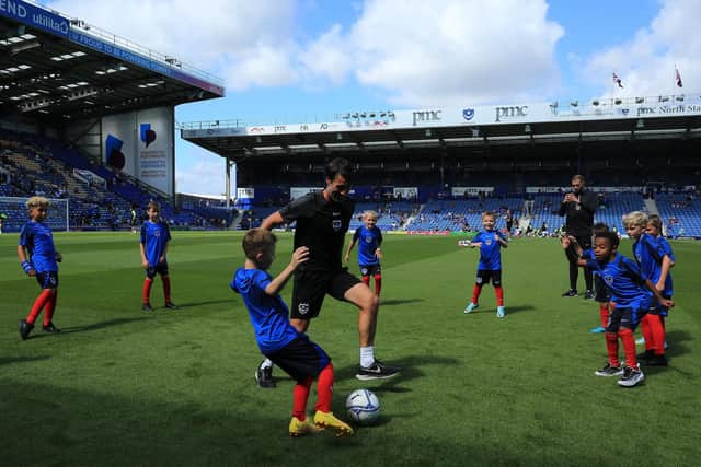 Danny Cowley takes part in a kickaround with the mascots before kick-off.