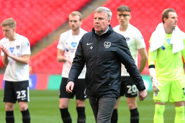 Kenny Jackett stands in front of his Pompey players after leading them out at Wembley - only to be relieved of his duties the following day. Picture: Joe Pepler