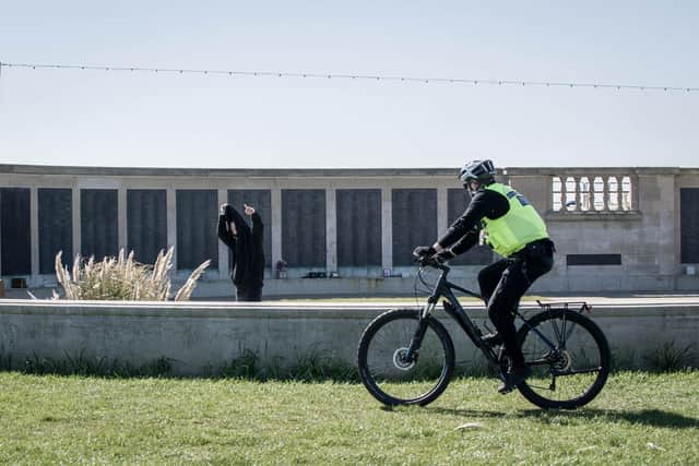 An officer cycles past Portsmouth Naval Memorial enforcing lockdown laws.
Picture: Habibur Rahman