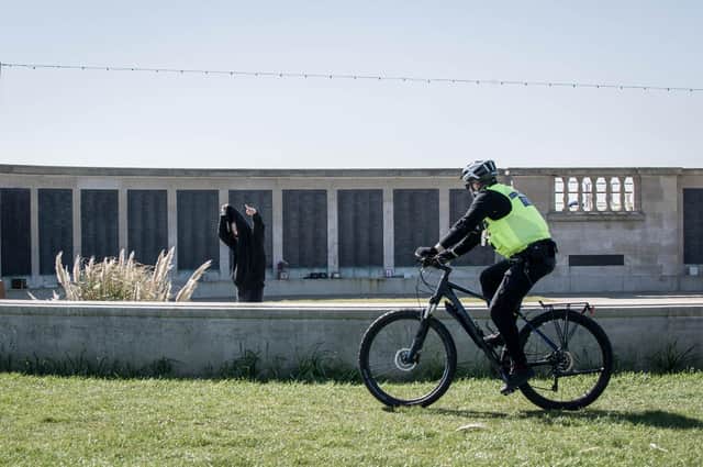An officer cycles past Portsmouth Naval Memorial enforcing lockdown laws.

Picture: Habibur Rahman