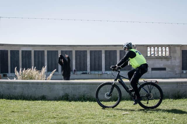An officer cycles past Portsmouth Naval Memorial enforcing lockdown laws.
Picture: Habibur Rahman