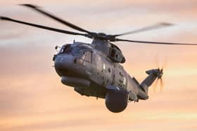 A Merlin helicopter pictured with the Crownest system fitted underneath it. Photo: Lockheed Martin