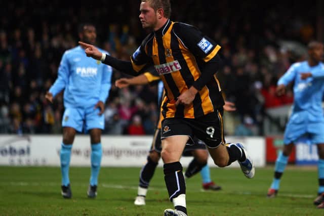 Scott Rendell  has just netted Cambridge United's winning penalty against Weymouth in the FA Cup second round in December 2007. Photo by Paul Gilham/Getty Images.