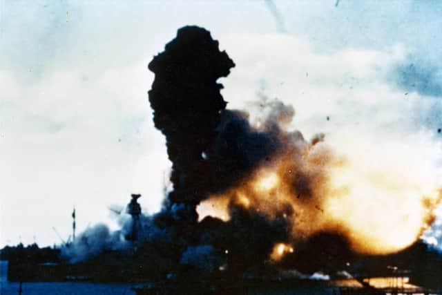 USS Arizona is torn apart as her magazine explodes with terrific force