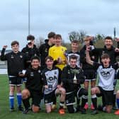 Captain Daniel Andrews (holding cup) celebrates with his Fleur de Lys Victory team after the Under-16 GEC Marconi Invitation Cup final win against Cowplain Youth. Picture: Chris Moorhouse