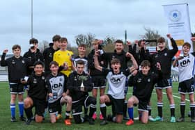 Captain Daniel Andrews (holding cup) celebrates with his Fleur de Lys Victory team after the Under-16 GEC Marconi Invitation Cup final win against Cowplain Youth. Picture: Chris Moorhouse