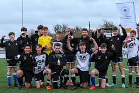 Captain Daniel Andrews (holding cup) celebrates with his Fleur de Lys Victory team after the Under-16 GEC Marconi Invitation Cup final win against Cowplain Youth. Picture: Chris Moorhouse