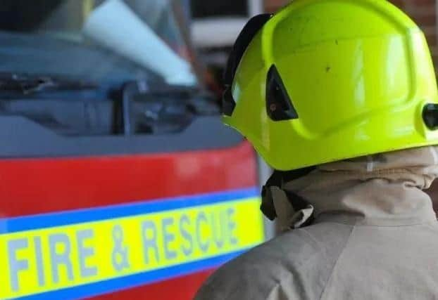 Firefighters from Havant were called to rescue a woman trapped by a car which rolled down a drive.