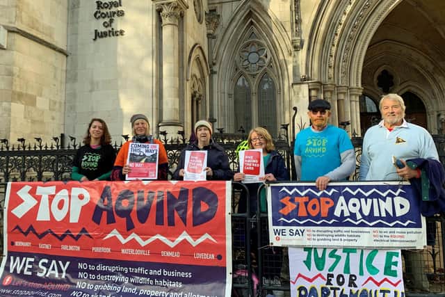 Portsmouth residents and members of the community campaign group Let's Stop Aquind, outside the Royal Courts of Justice in London during the judicial review 
in November Picture: PA