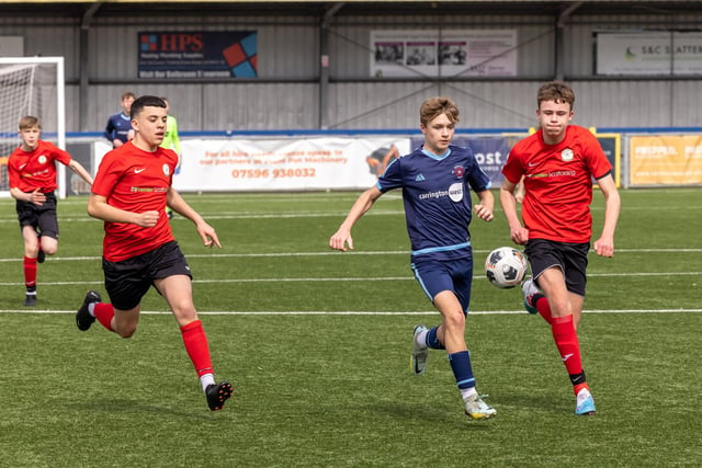 Action from the Under-14 Memorial Challenge Cup final between Pickwick Youth Pumas (all blue kit) and Horndean Youth Red. Picture: Mike Cooter