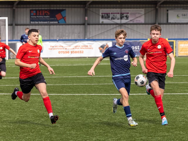 Action from the Under-14 Memorial Challenge Cup final between Pickwick Youth Pumas (all blue kit) and Horndean Youth Red. Picture: Mike Cooter