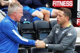 Leam Richardson, right, shakes hands with Pompey boss Kenny Jackett. Picture: Joe Pepler