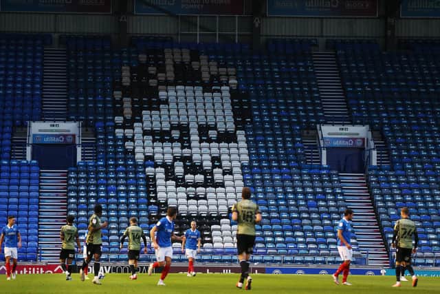Jimmy Dickinson's face is immortalised on the seats in Pompey's Fratton end