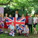 Havant MP Alan Mak visited Bosmere Junior School to present pupils with a Union Flag which was flown during their Platinum Jubilee Party.