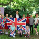 Havant MP Alan Mak visited Bosmere Junior School to present pupils with a Union Flag which was flown during their Platinum Jubilee Party.