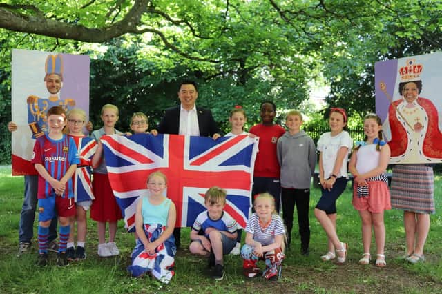 Havant MP Alan Mak visited Bosmere Junior School to present pupils with a Union Flag which was flown during their Platinum Jubilee Party.
