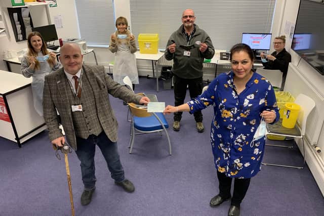 Gary Weaving, CEO of Forgotten Veterans UK. and Mrs Laly, founder and director of Lalys Pharmacy. Behind: Benarda Alcani, nurse, Hanieh Majidi, pharmacist, Martin Farrow, volunteer, and Sophie Furmedge, dispenser.