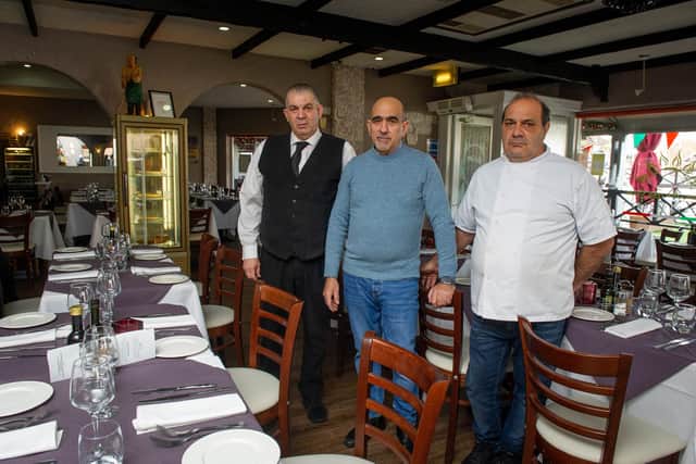 O Sole Mio Two, Port Solent, has been trading on The Boardwalk for years, but has been struggling with the rise customer cancellations. Pictured: Front of house, Saverio Mindicino, manager Giobinni Paccaro and owner Roberto Fortuna, on Wednesday 8th December 2021. Picture: Habibur Rahman.