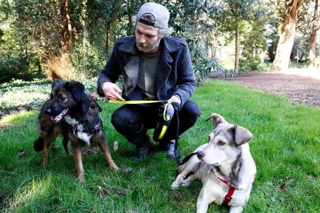 Aaran Wright with new dog Alin who was rescued from a kill shelter.
