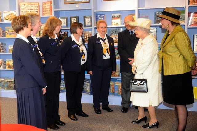 The Queen visits Portsmouth, pictured at the D-Day Museum with staff.