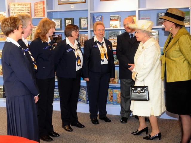The Queen visits Portsmouth, pictured at the D-Day Museum with staff.